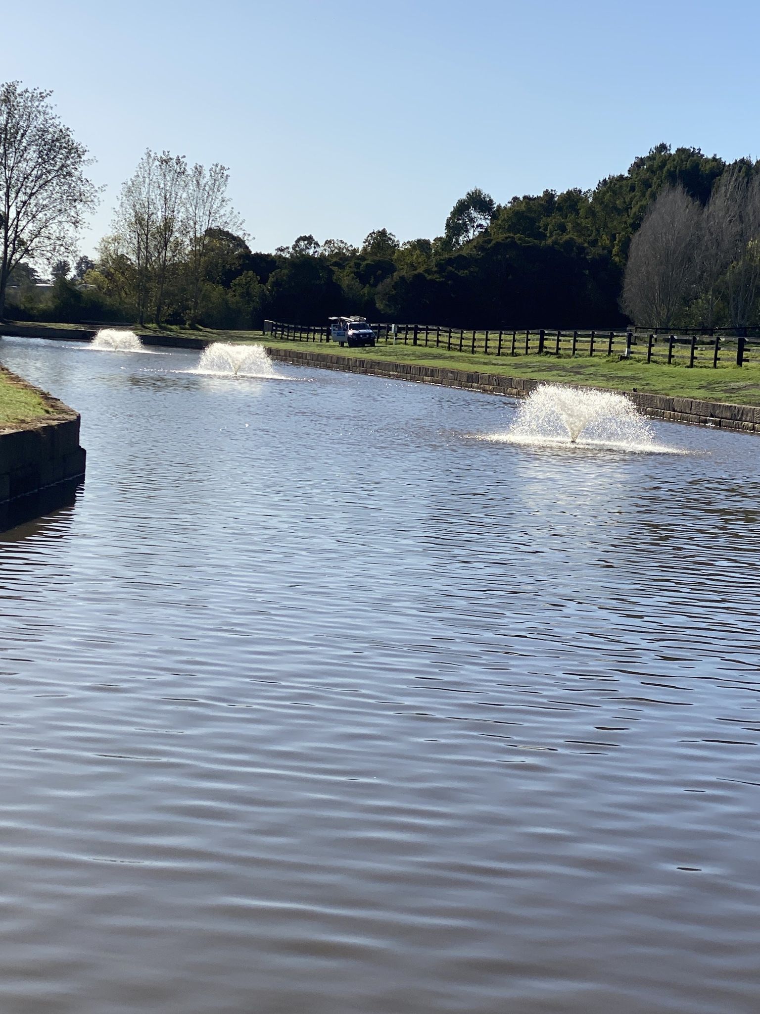 Three aerators running on a farm dam